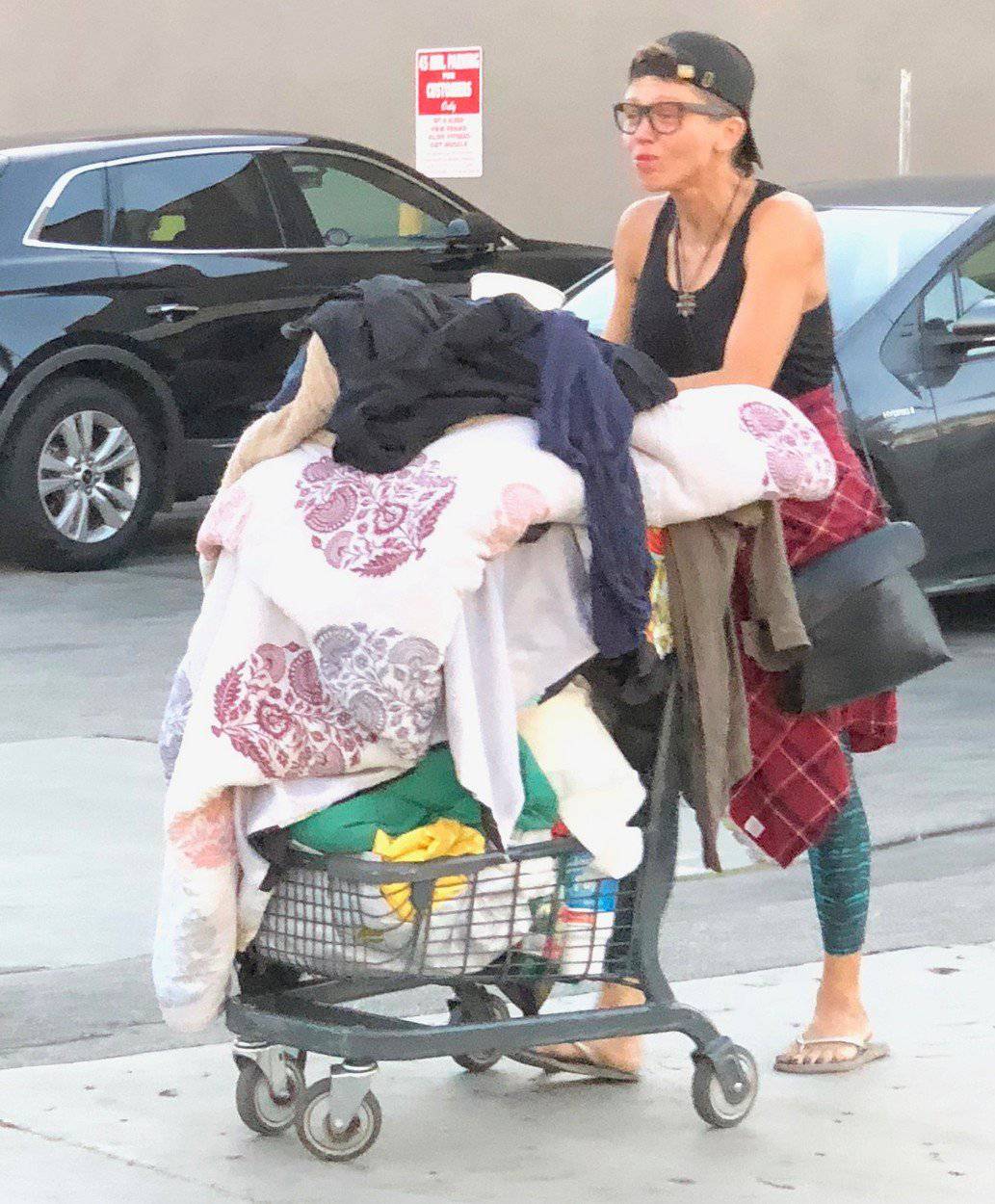EXCLUSIVE: Baywatch star Jeremy Jackson ex wife Loni Willison seen rummaging through trash cans