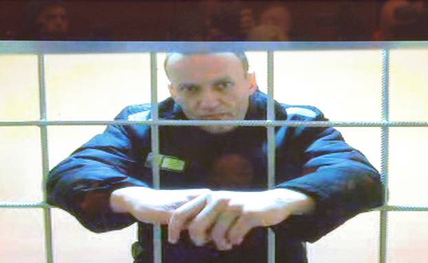 FILE PHOTO: Jailed Russian opposition leader Alexei Navalny is seen on a screen during a court hearing in Moscow