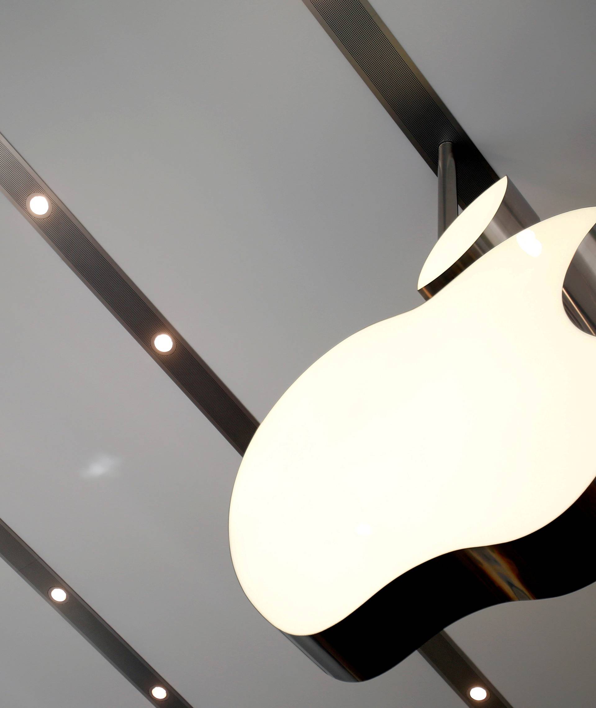 FILE PHOTO: Apple logo is pictured inside the newly opened Omotesando Apple store at a shopping district in Tokyo, Japan