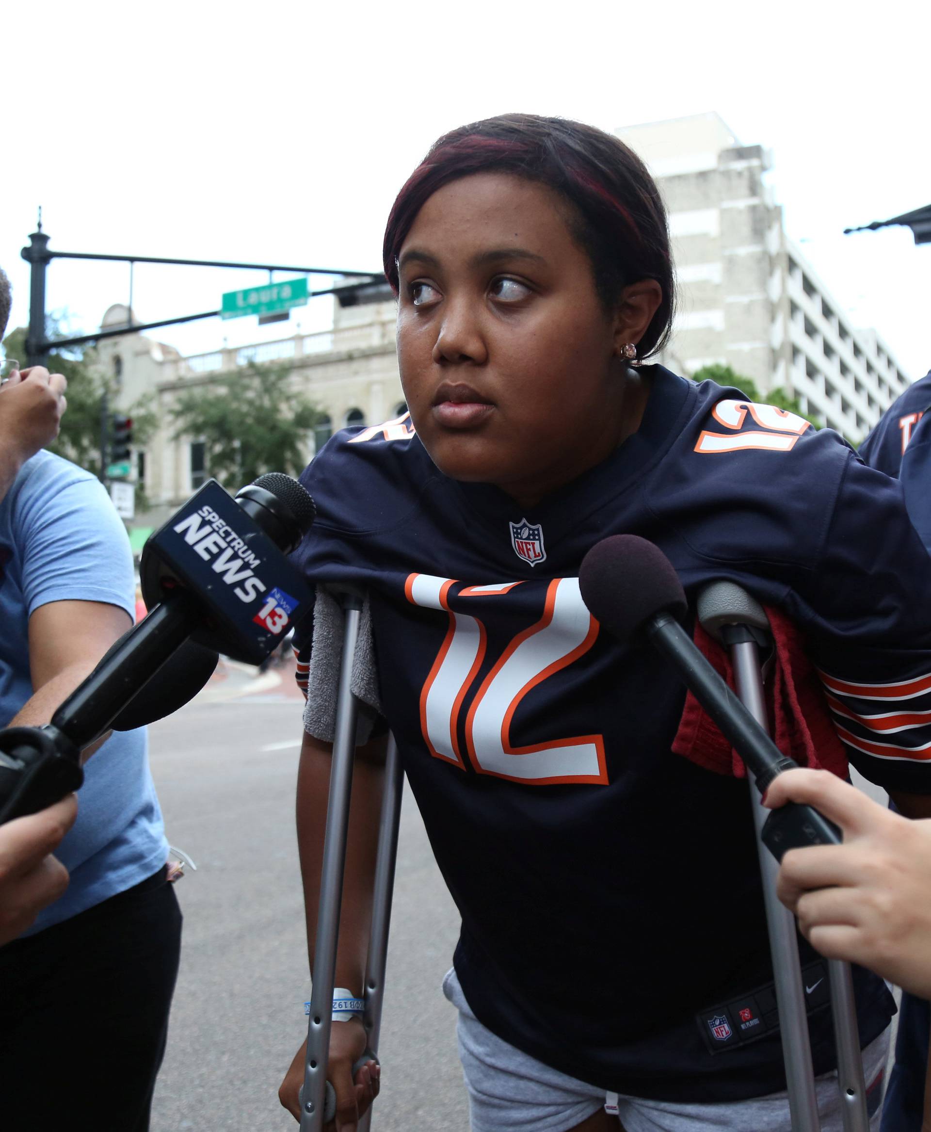 Taylor Poindexter speaks to reporters after witnessing a gunman open fire on gamers in Jacksonville