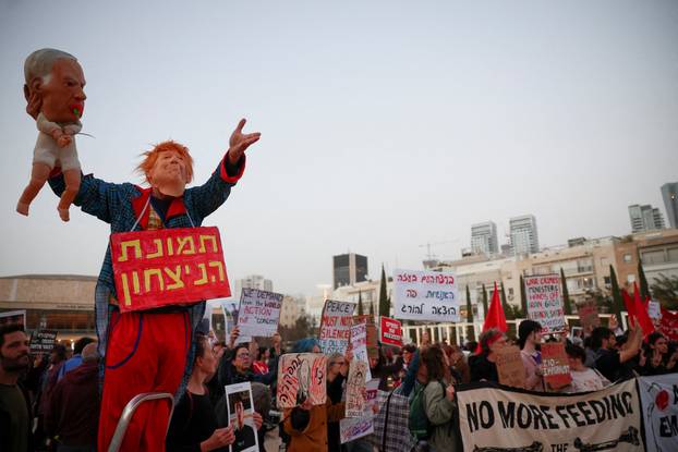 Israelis take part in an anti-war protest in Tel Aviv