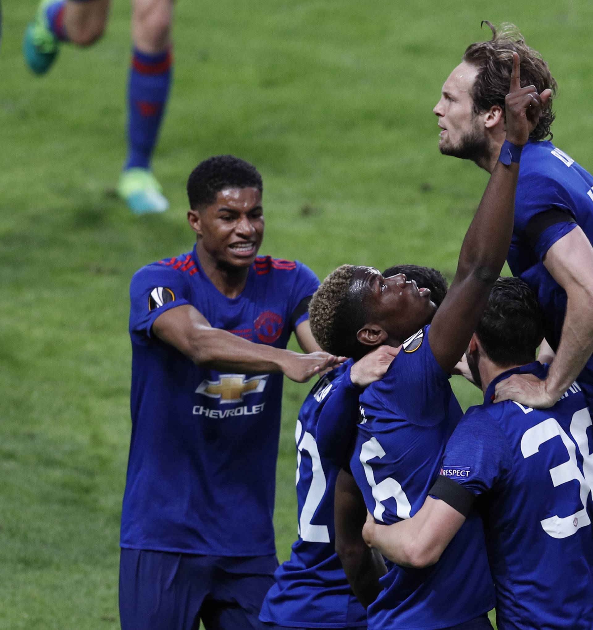 Manchester United's Paul Pogba celebrates scoring their first goal with team mates