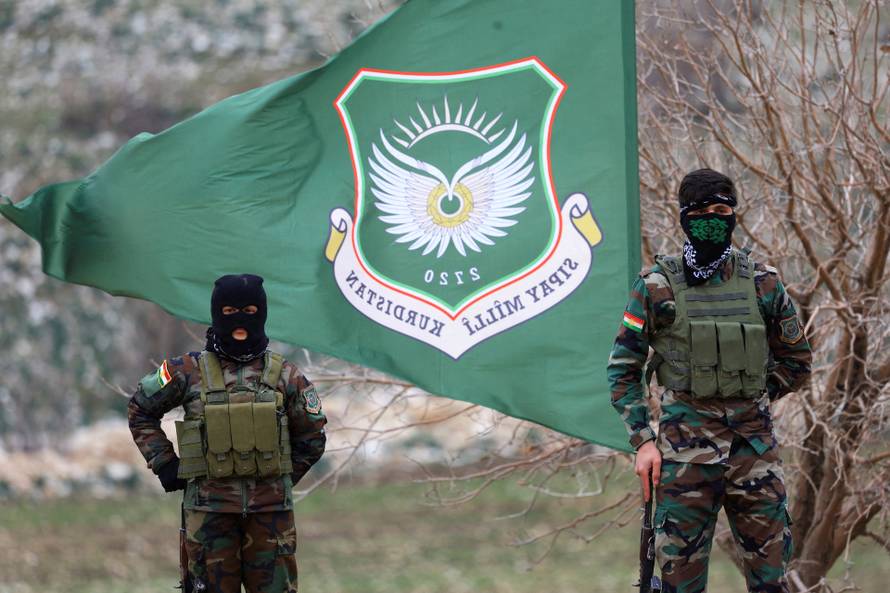 FILE PHOTO: Iranian Kurdish fighters from the Kurdistan Freedom Party (PAK) take part in a training session at a base on the outskirts of Erbil