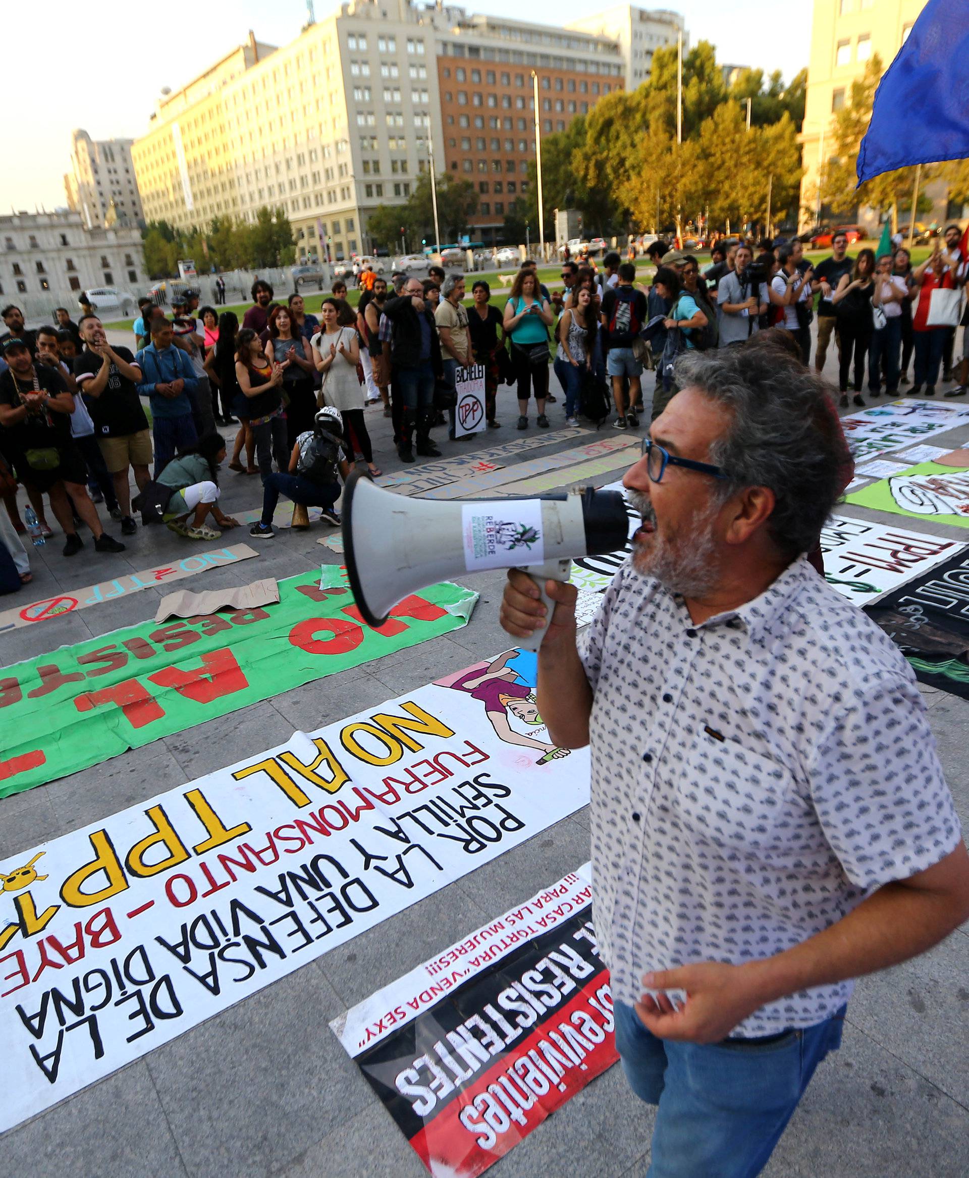 A demonstrator shouts slogans during a rally against the Trans-Pacific Partnership trade deal in Santiago,