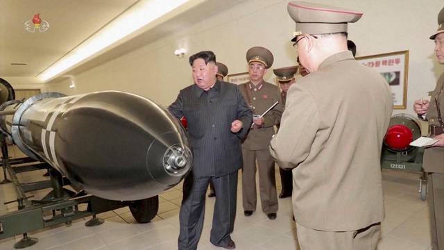 FILE PHOTO: North Korean leader Kim Jong Un inspects nuclear warheads at an undisclosed location