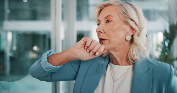 Business, thinking and woman in workplace, anxiety and financial agency with debt audit. Mature person, employee and investor with burnout, mistake and pressure with bankruptcy, stress or decision