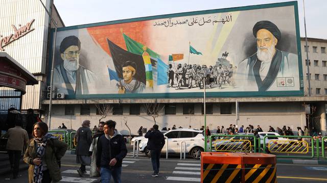 A mural depicting the late leader of the Islamic Revolution Ayatollah Ruhollah Khomeini and Iran's Supreme Leader Ayatollah Ali Khamenei are seen in Tehran