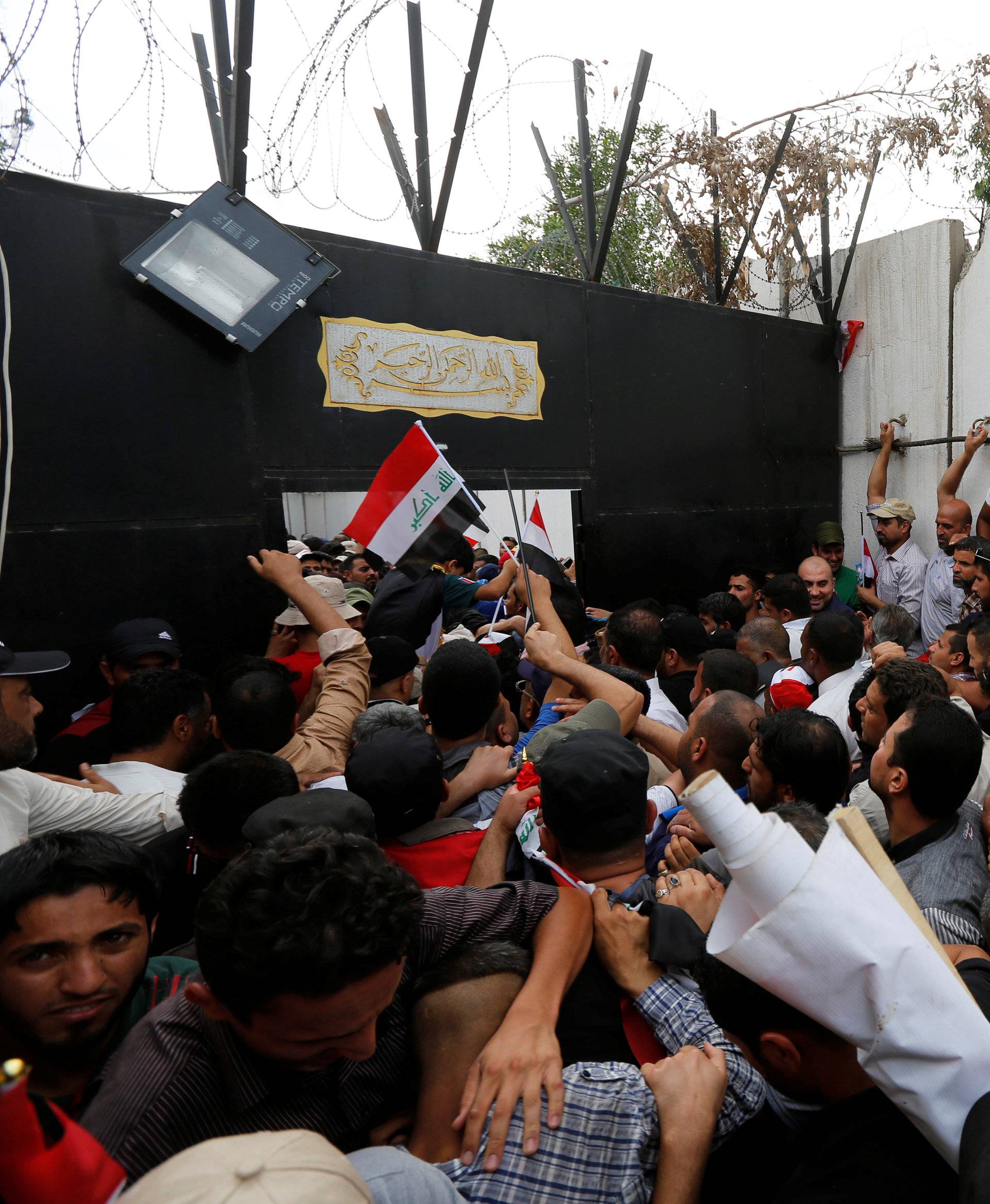 Followers of Iraq's Shi'ite cleric Moqtada al-Sadr storm Baghdad's Green Zone after lawmakers failed to convene for a vote on overhauling the government, in Iraq 