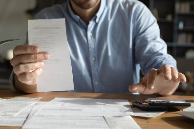 Payment,Check.,Cropped,Close,Up,Young,Businessman,Do,Financial,Paperwork