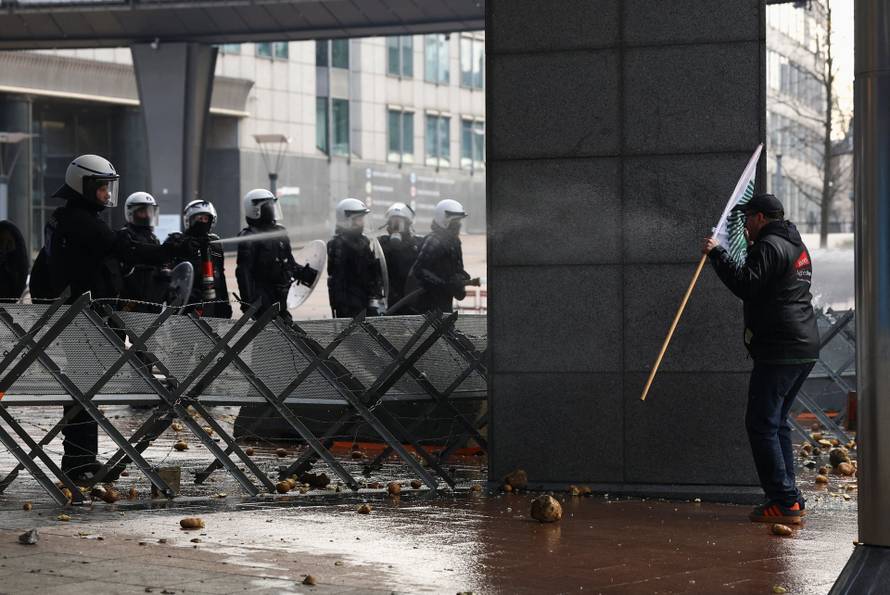 Farmers rally in a large-scale protest in Brussels as leaders meet in EU summit