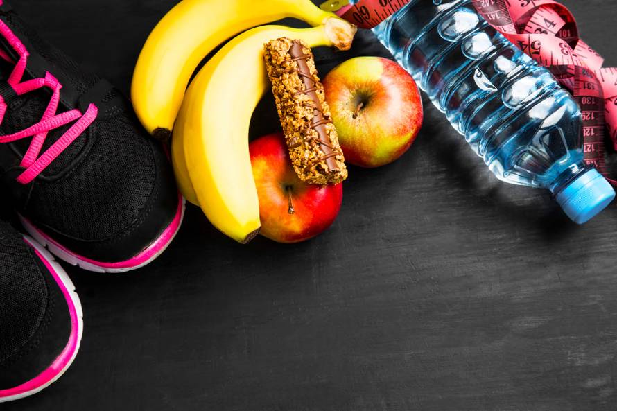 Healthy lifestyle with sport items , fruits and water
