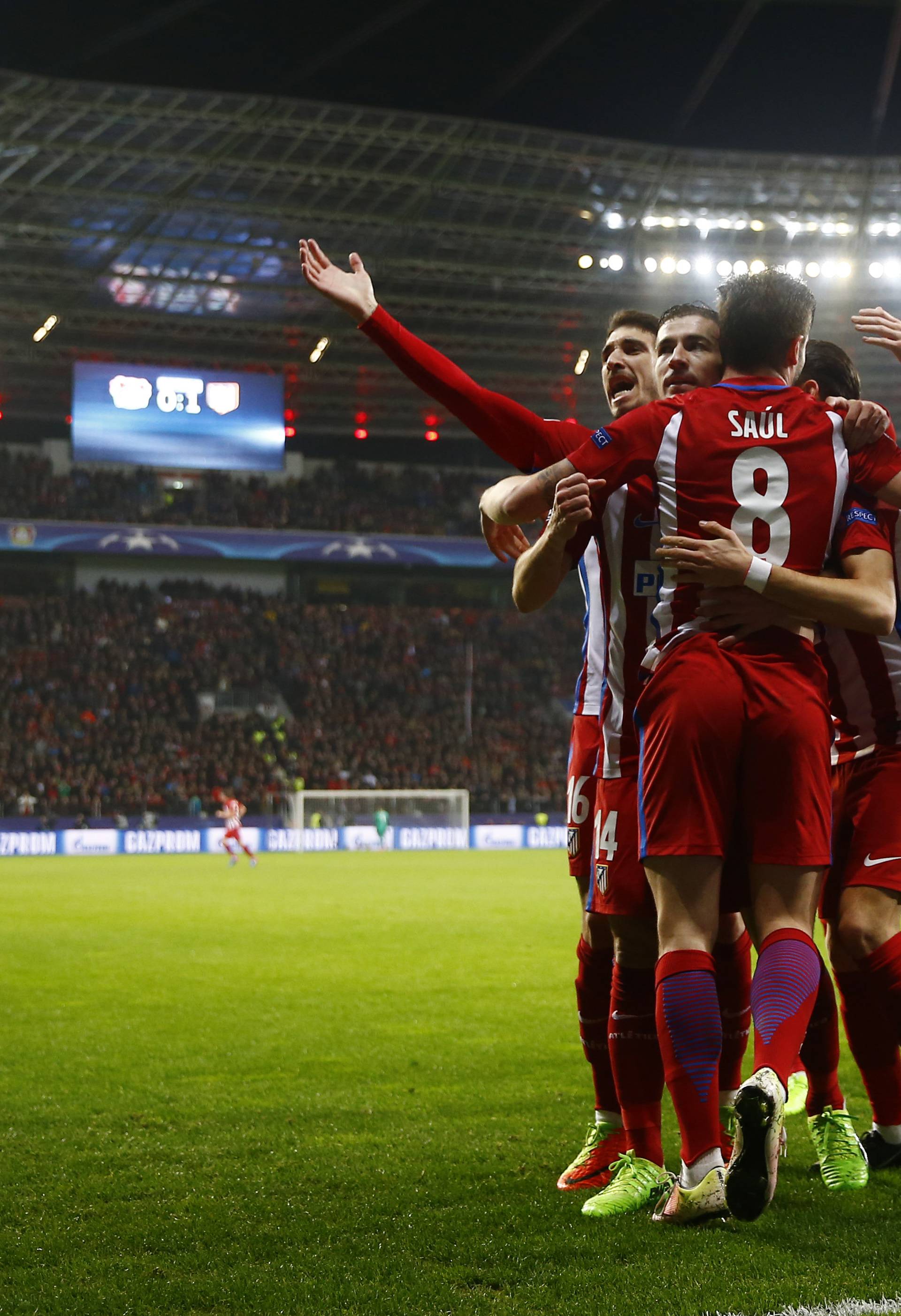 Atletico Madrid's Saul Niguez celebrates scoring their first goal with teammates