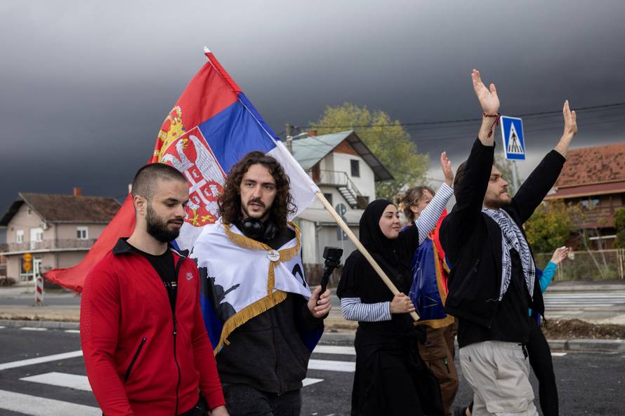 Students from Novi Pazar marching from Valjevo to Ub as part of a journey leading up to a major protest in Novi Sad