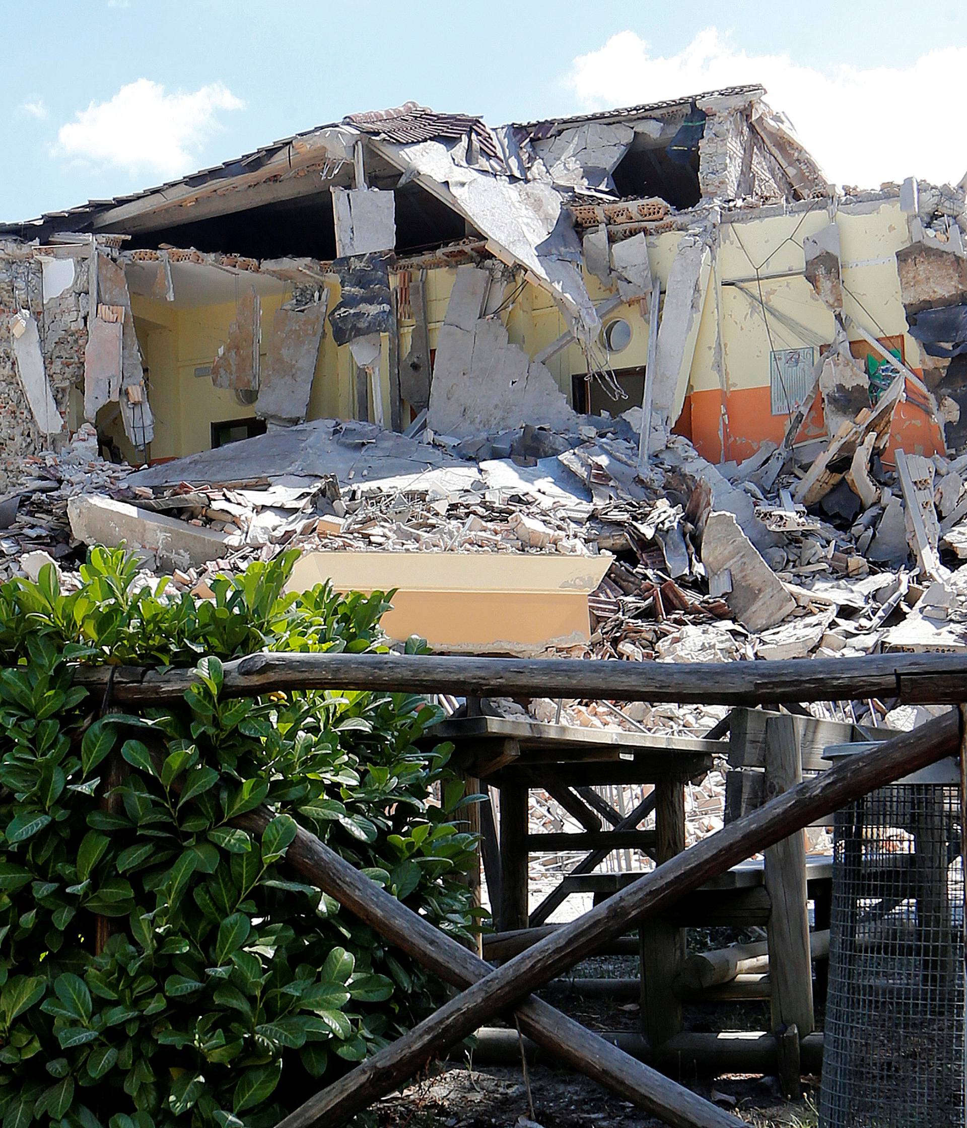 The school is seen partially collapsed following an earthquake in Amatrice