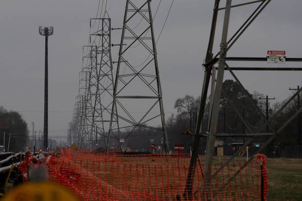 Overhead power lines are seen during record-breaking temperatures in Houston, Texas