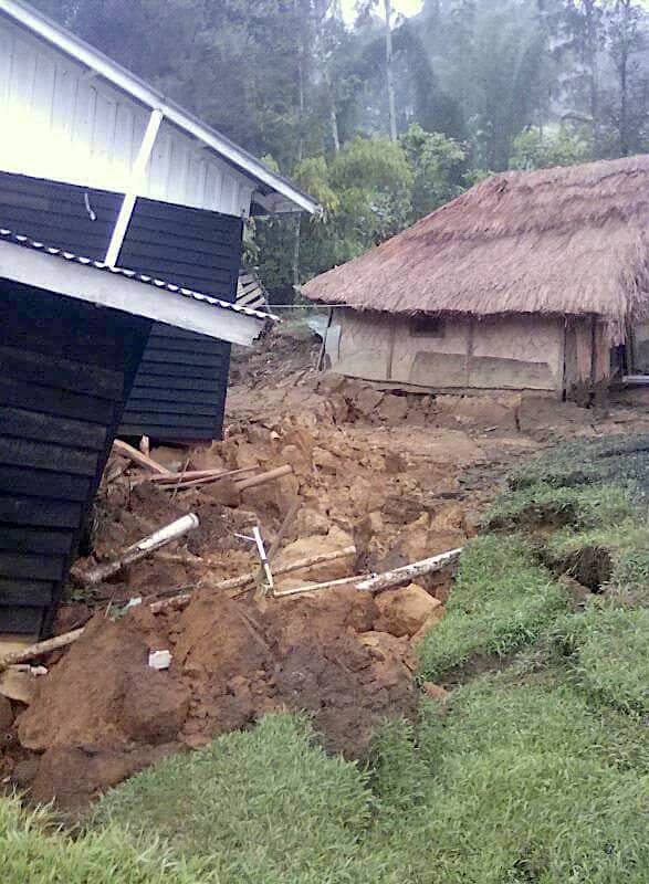 A damaged house is seen near a landslide in the town of Tari after an earthquake struck Papua New Guinea's Southern Highlands