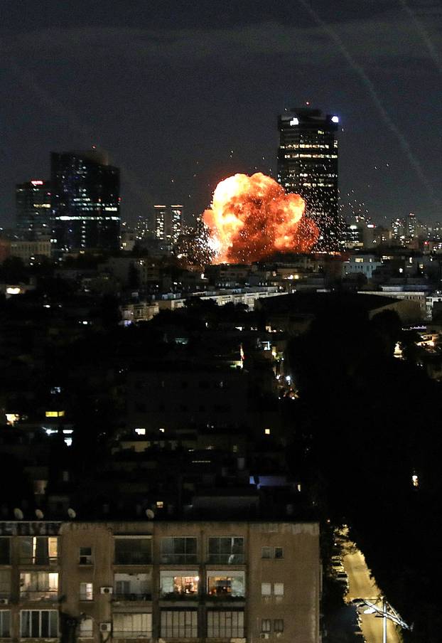 An explosion caused by a projectile impact after Iran launched missiles into Israel following Israel and the U.S. launched strikes on Iran, in Tel Aviv