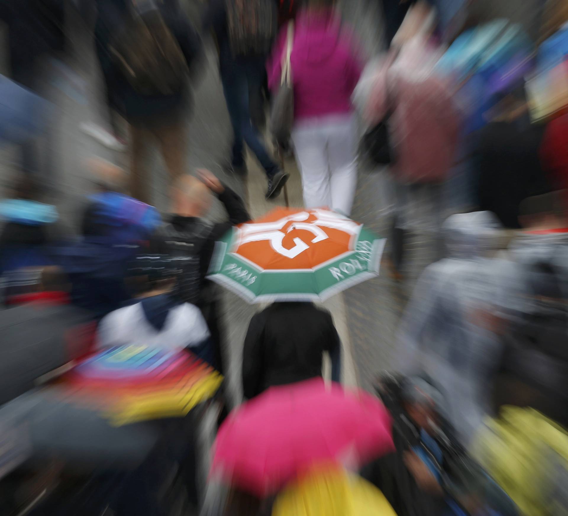 Tennis - French Open - Roland Garros - Spectators leave after matches are cancelled  by rain 