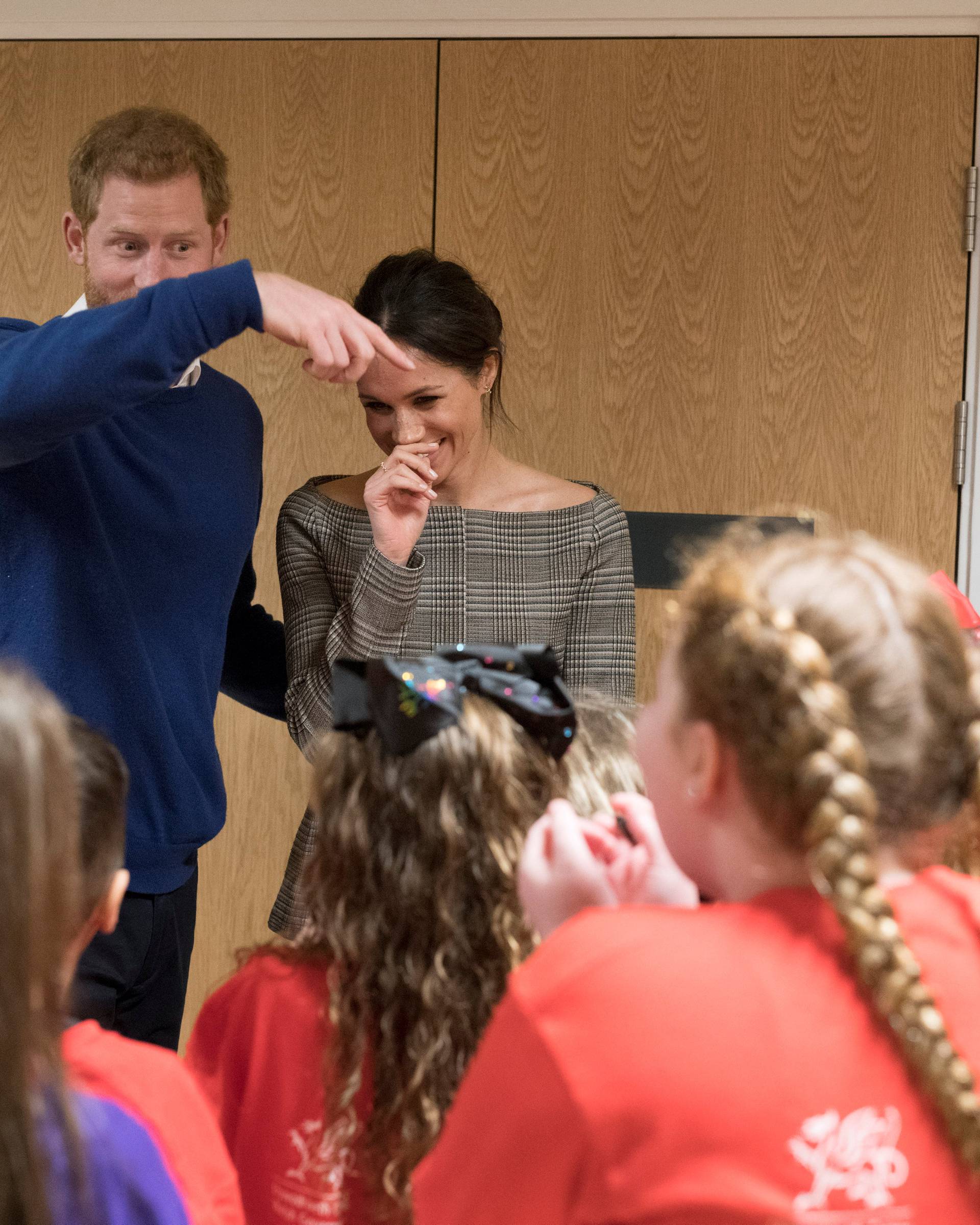 Britain's Prince Harry and his fiancee Meghan Markle attend a street dance class during their visit to Star Hub, a community and leisure centre, in Cardiff