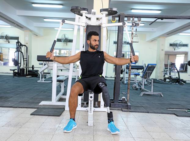 Egyptian swimmer Omar Hegazy, who is the first one-legged man to swim across the Gulf of Aqaba from Egypt to Jordan, works out at a gym in Cairo