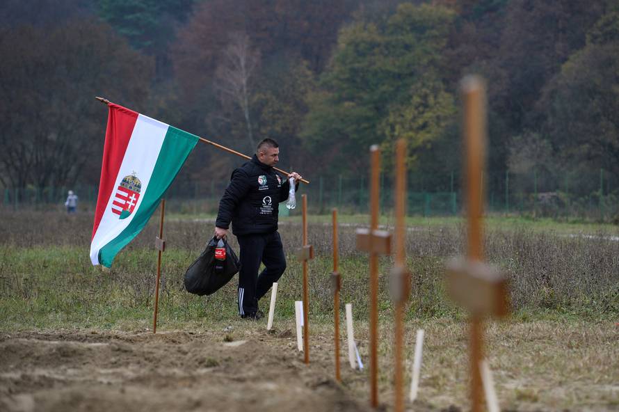 A Hungarian gravedigger finishes his work during a grave digging championship in Trencin, Slovakia