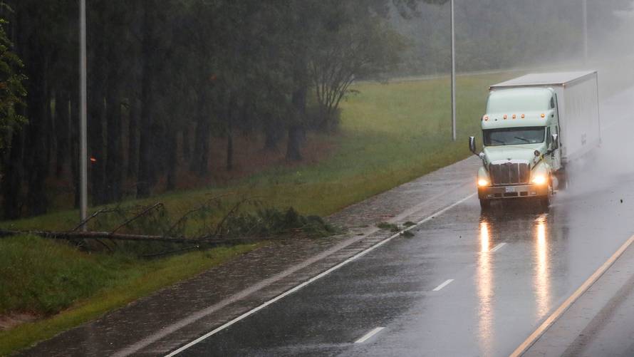 A truck drives along a I 95 Road as winds from Hurricane Florence hit the town of Wilson, North Carolina