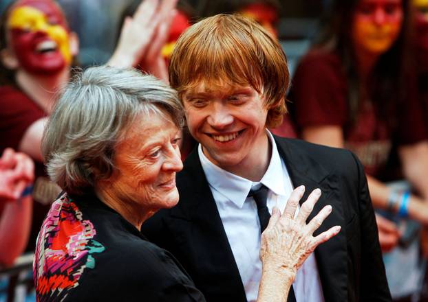 FILE PHOTO: Maggie Smith and Rupert Grint share a light moment on the red carpet as they arrive for the world premiere of "Harry Potter and the Half Blood Prince" at Leicester Square in London