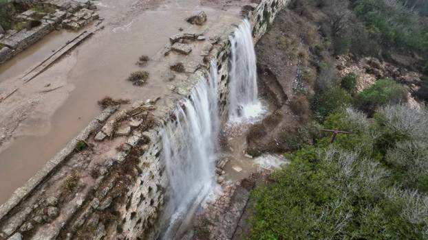 Aerial view of flood water as a powerful storm and heavy rainfall hit Shahhat city