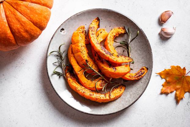 Roasted,Pumpkin,Slices,With,Garlic,And,Herbs.,Oven,Baked,Pumpkin,