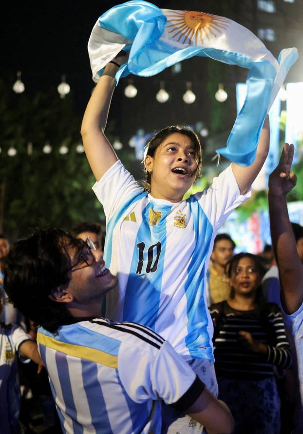 Fans celebrate at the screening of the semi-final game between England and Argentina of the 2026 FIFA World Cup in Kolkata