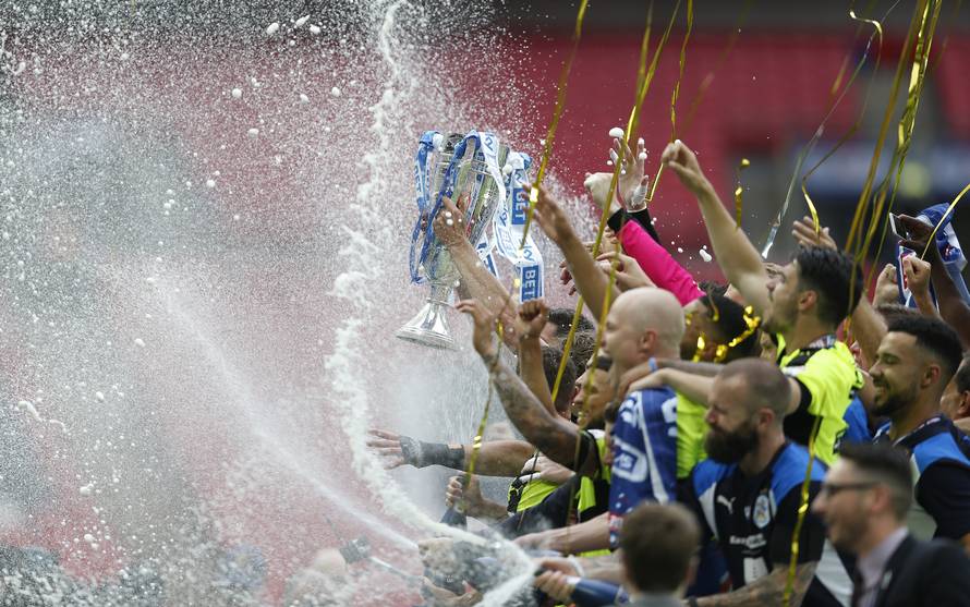 Huddersfield Town celebrate with the trophy after winning the Sky Bet Championship Play-Off Final and getting promoted to the Premier League