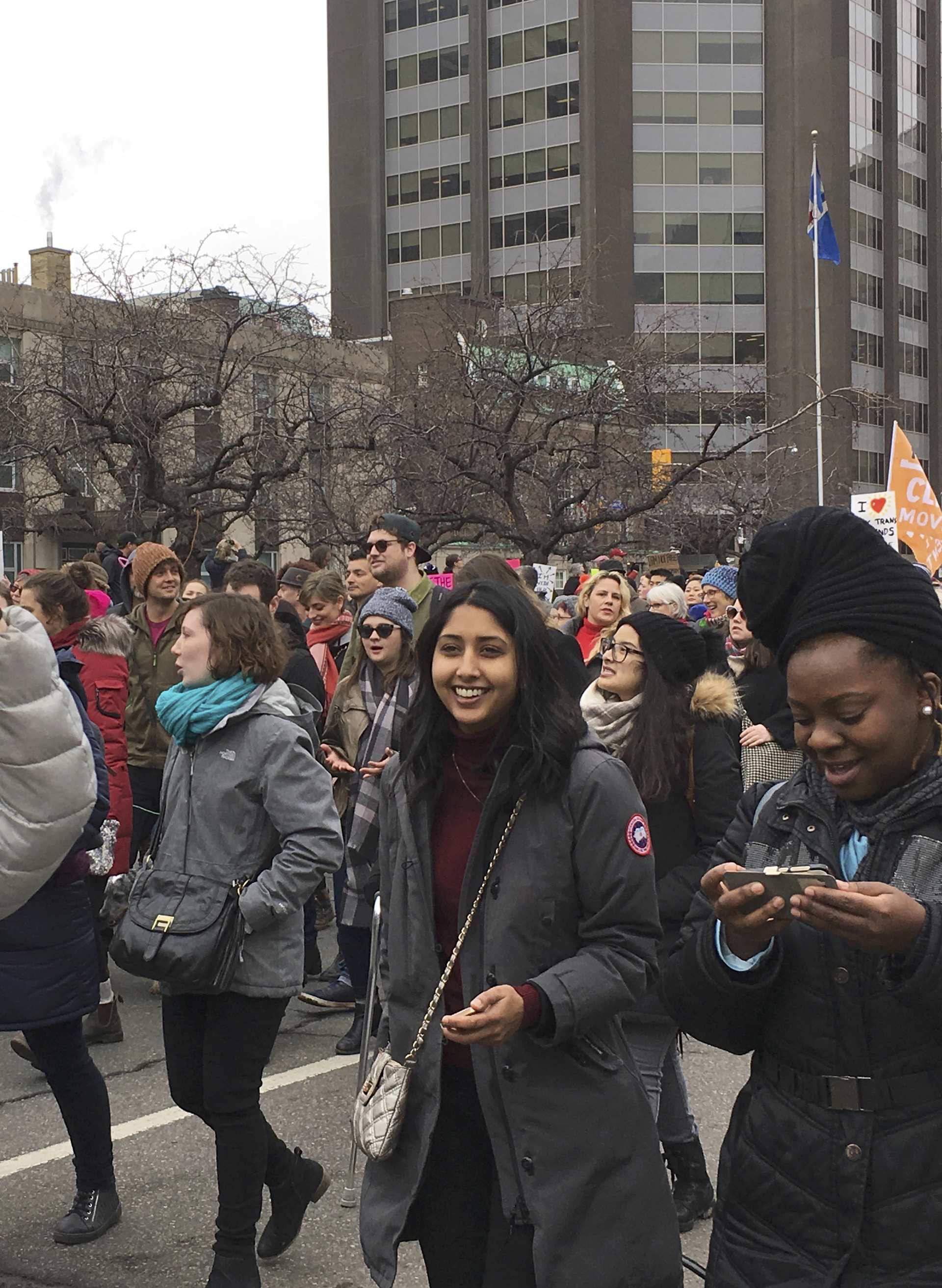 Thousands of people, many wearing pink hats, chanted, cheered and held protest signs while marching to the U.S. consulate in Toronto