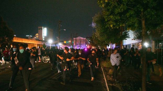 People react after a decision in the criminal case against police officers involved in the death of Breonna Taylor in Louisville