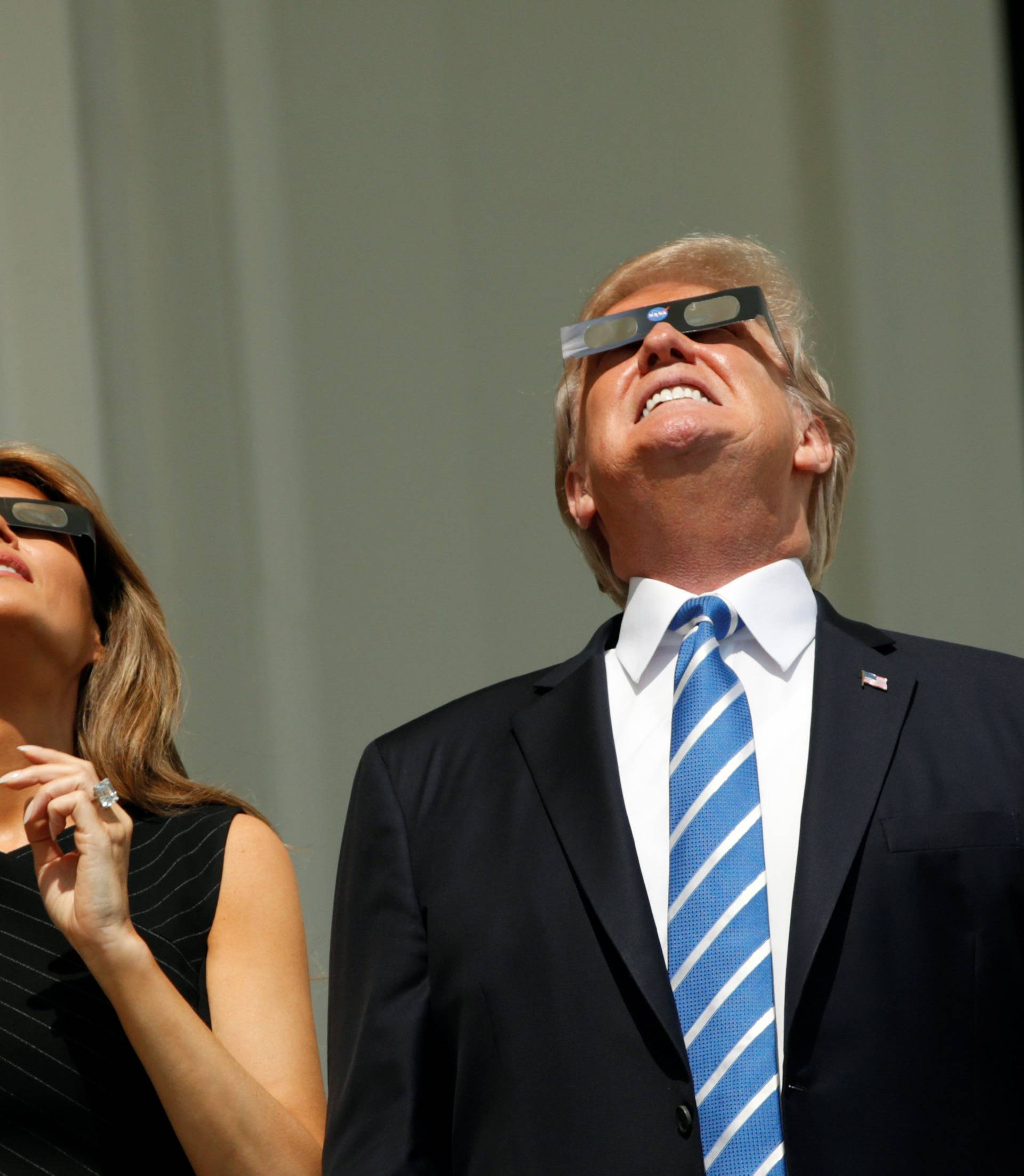 U.S. President Trump and Melania Trump watch the solar eclipse from the White House in Washington