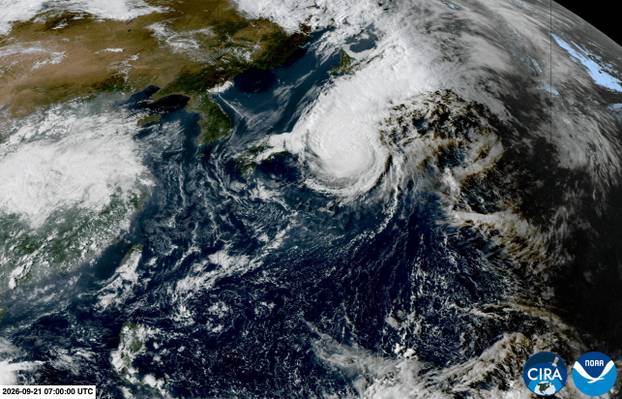 A satellite view shows a typhoon Dujuan approaching Japan