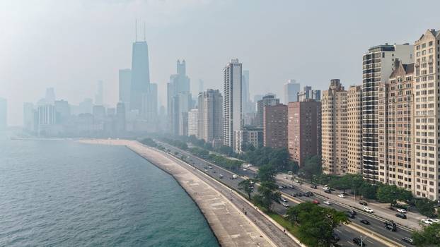 Canadian wildfire smoke shrouds the skyline in Chicago