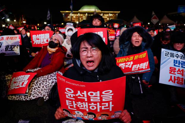 Protesters take part in a rally calling for the impeachment of South Korean President Yeol, in Seoul