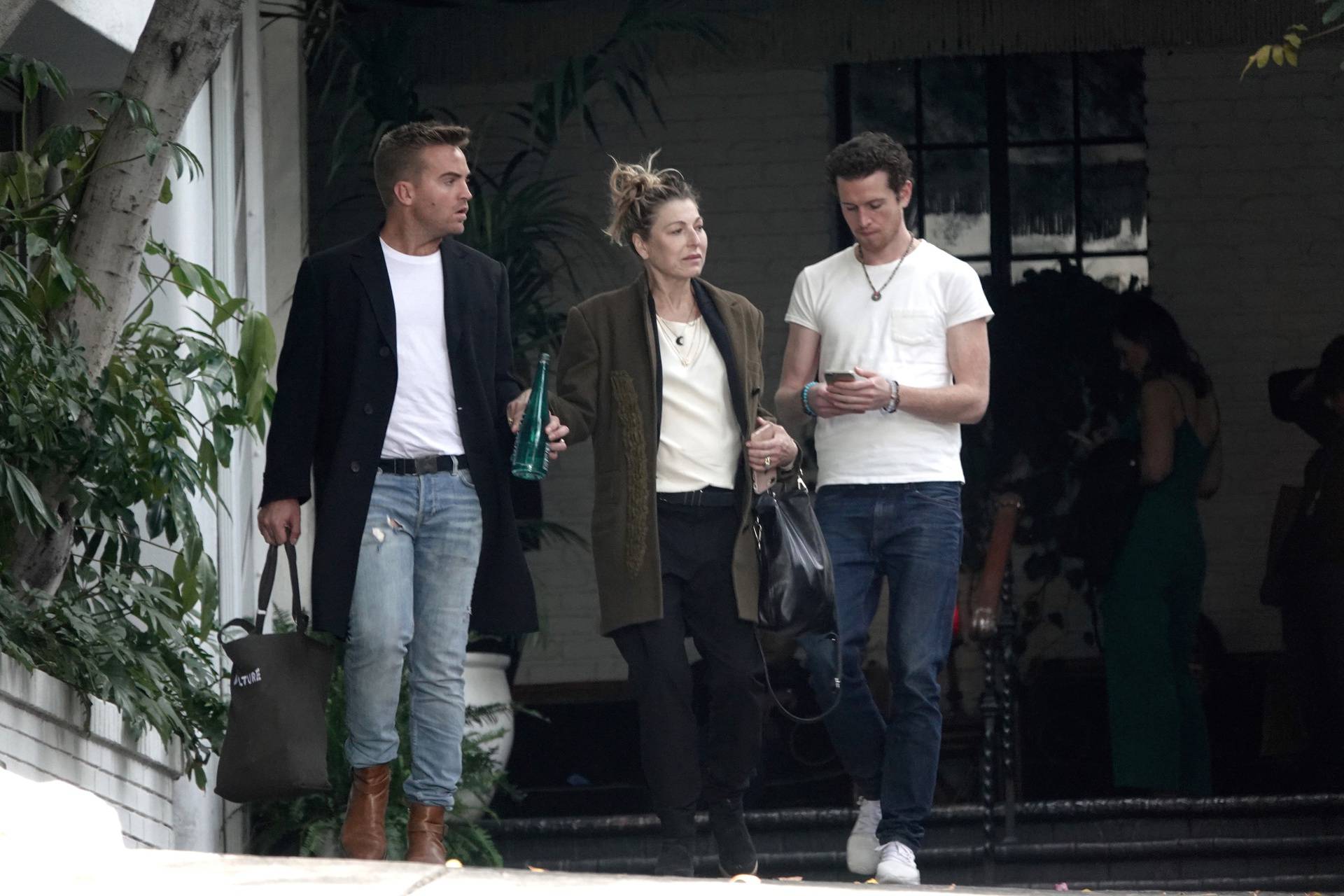 EXCLUSIVE: Tatum O'Neal and her son Sean O'Neal seen leaving lunch at Chateau Marmont and posing for photos with Australian songwriter James Maas