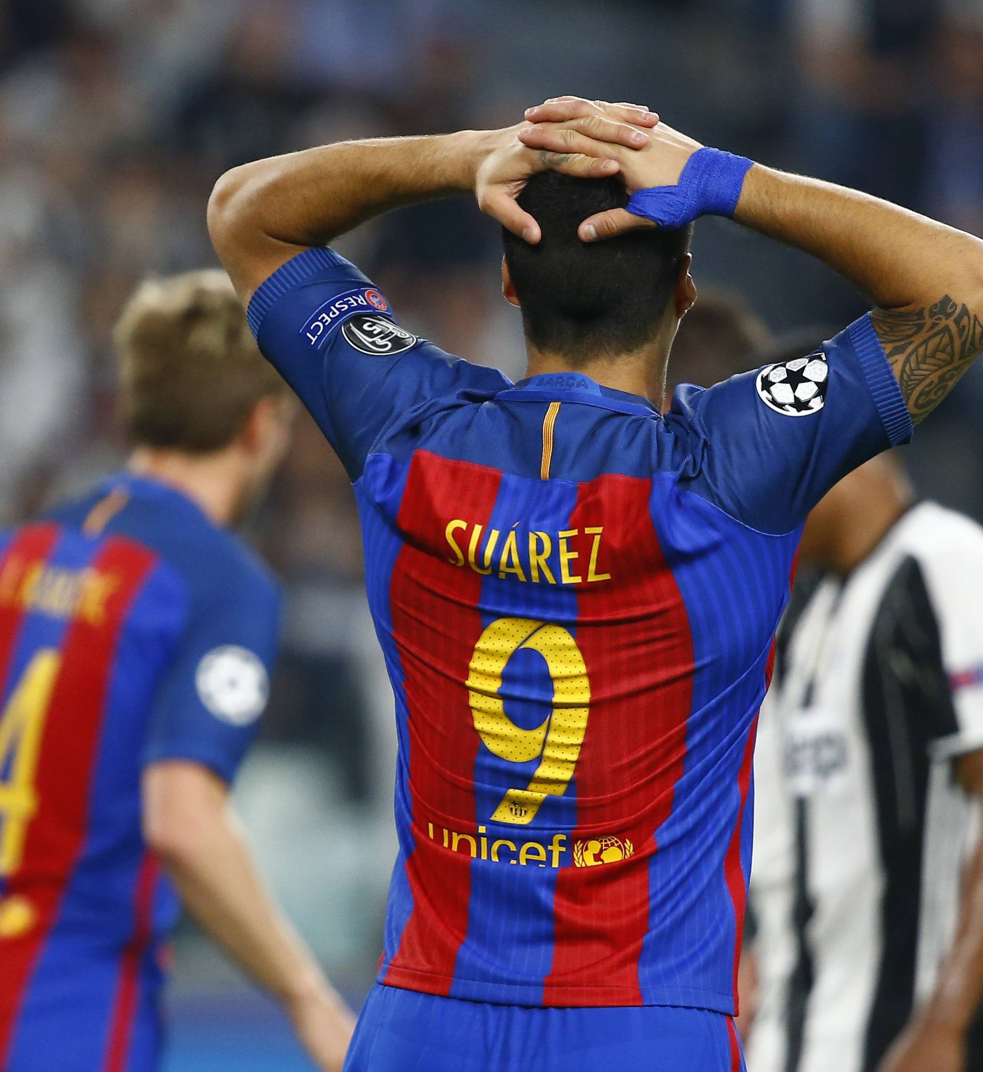 Barcelona's Luis Suarez looks dejected after Juventus' Paulo Dybala scored their second goal