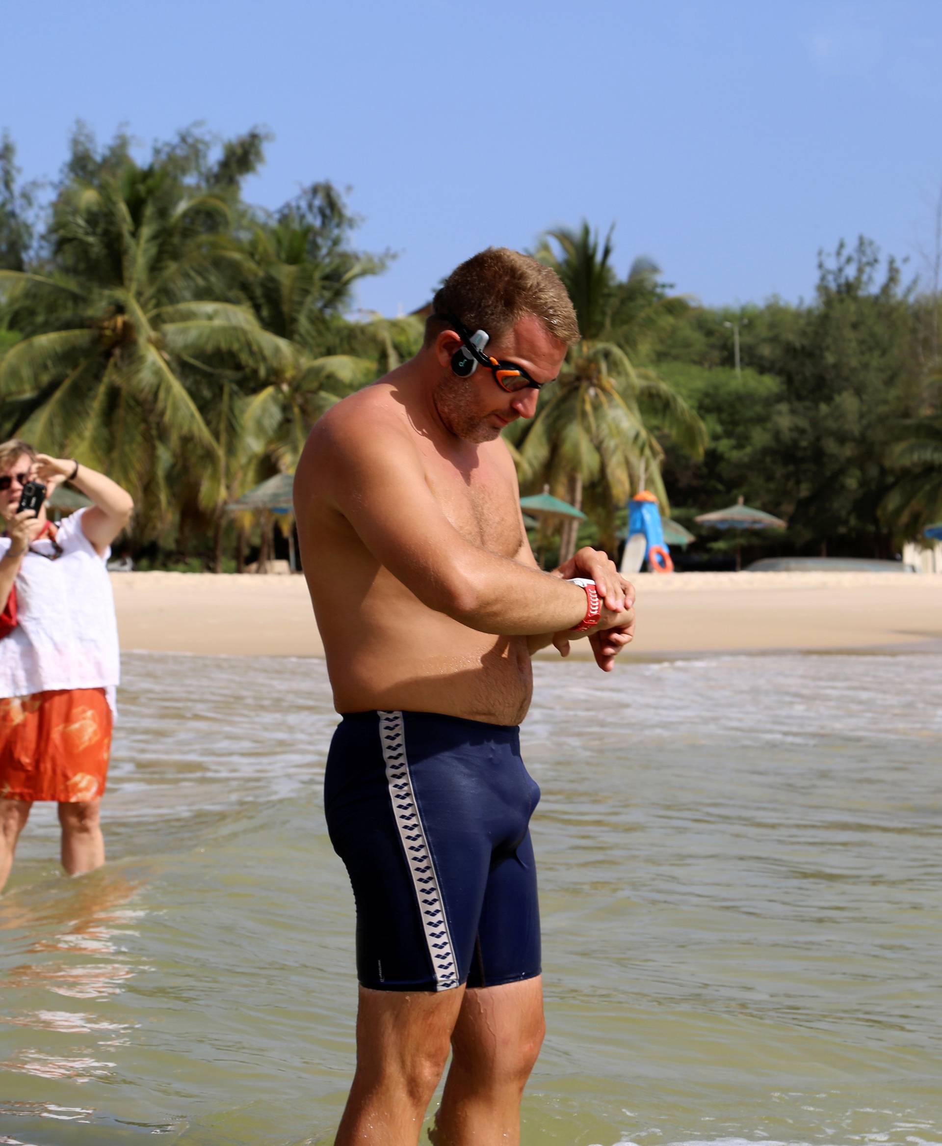 Ben Hooper, 38, adjusts his watch before starting a swim across the Atlantic from Dakar