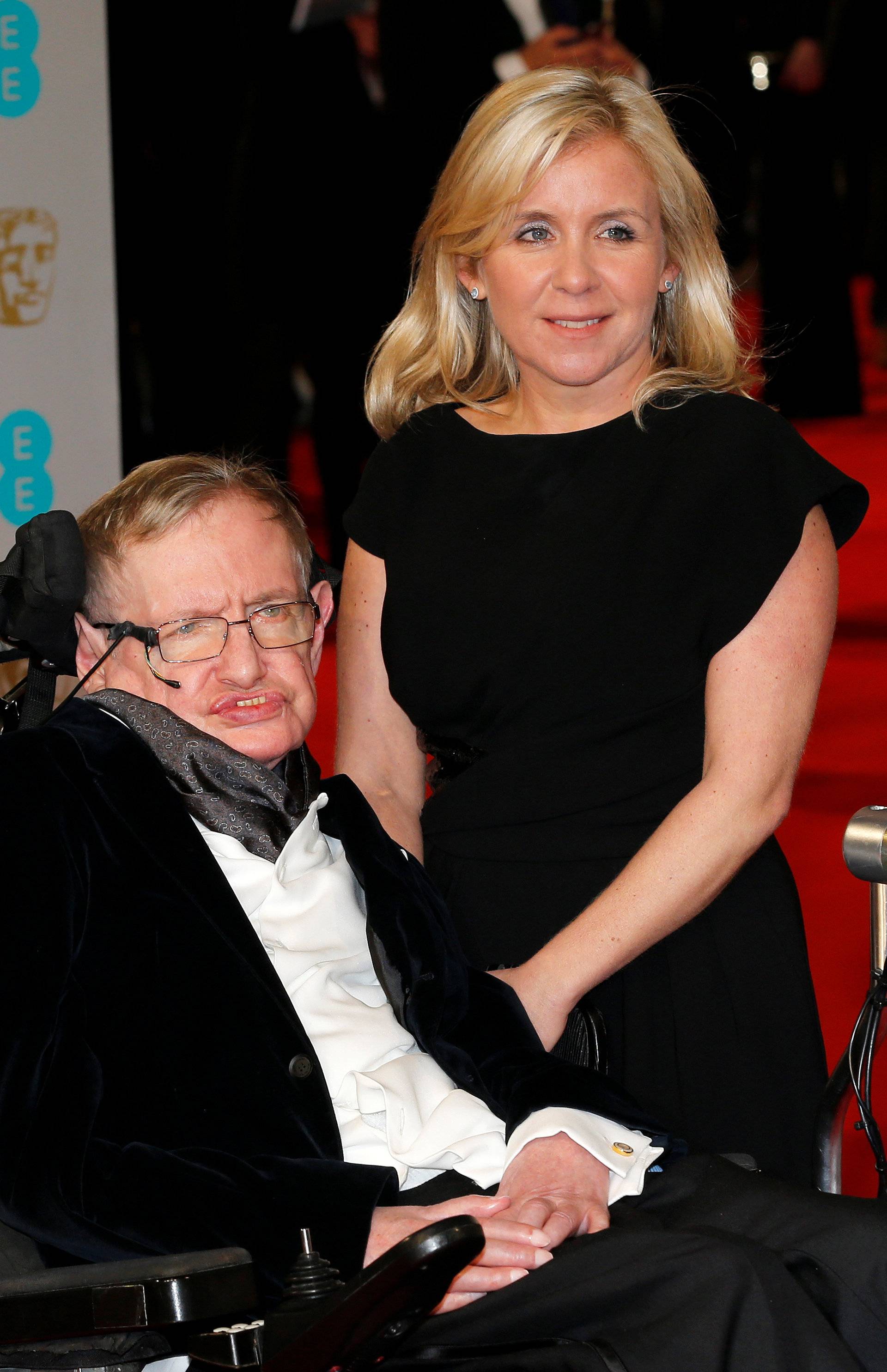 FILE PHOTO: Theoretical physicist Stephen Hawking and his daughter Lucy arrive at the British Academy of Film and Arts (BAFTA) awards ceremony at the Royal Opera House in London
