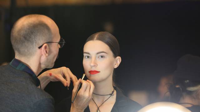 Models are prepped backstage before presenting creations from the Oscar de la Renta Fall 2020 collection during New York Fashion Week