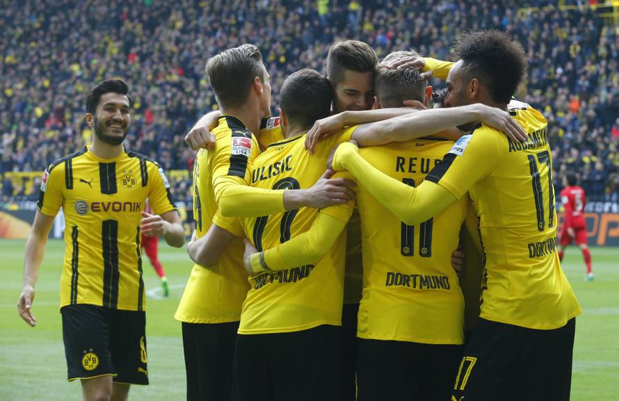 Borussia Dortmund's Marco Reus celebrates scoring their first goal with team mates