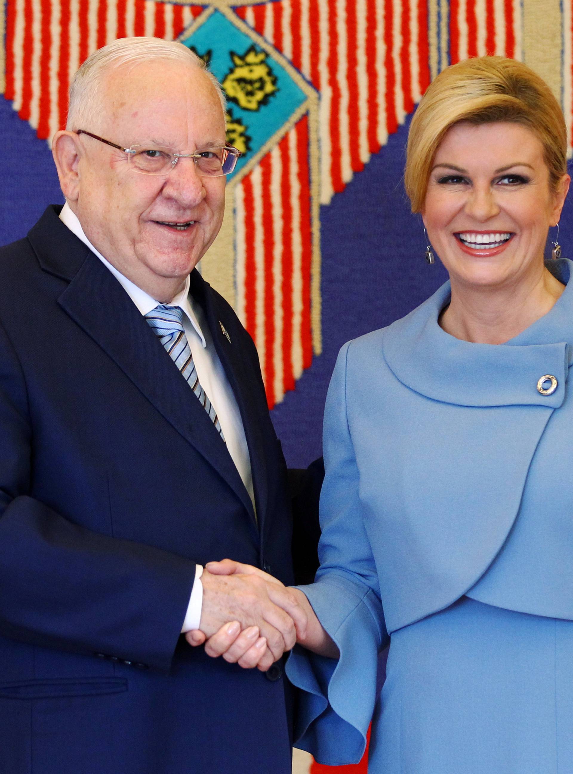 Croatia's President Kolinda Grabar-Kitarovic shakes hands with Israel's President Reuven Rivlin in Zagreb