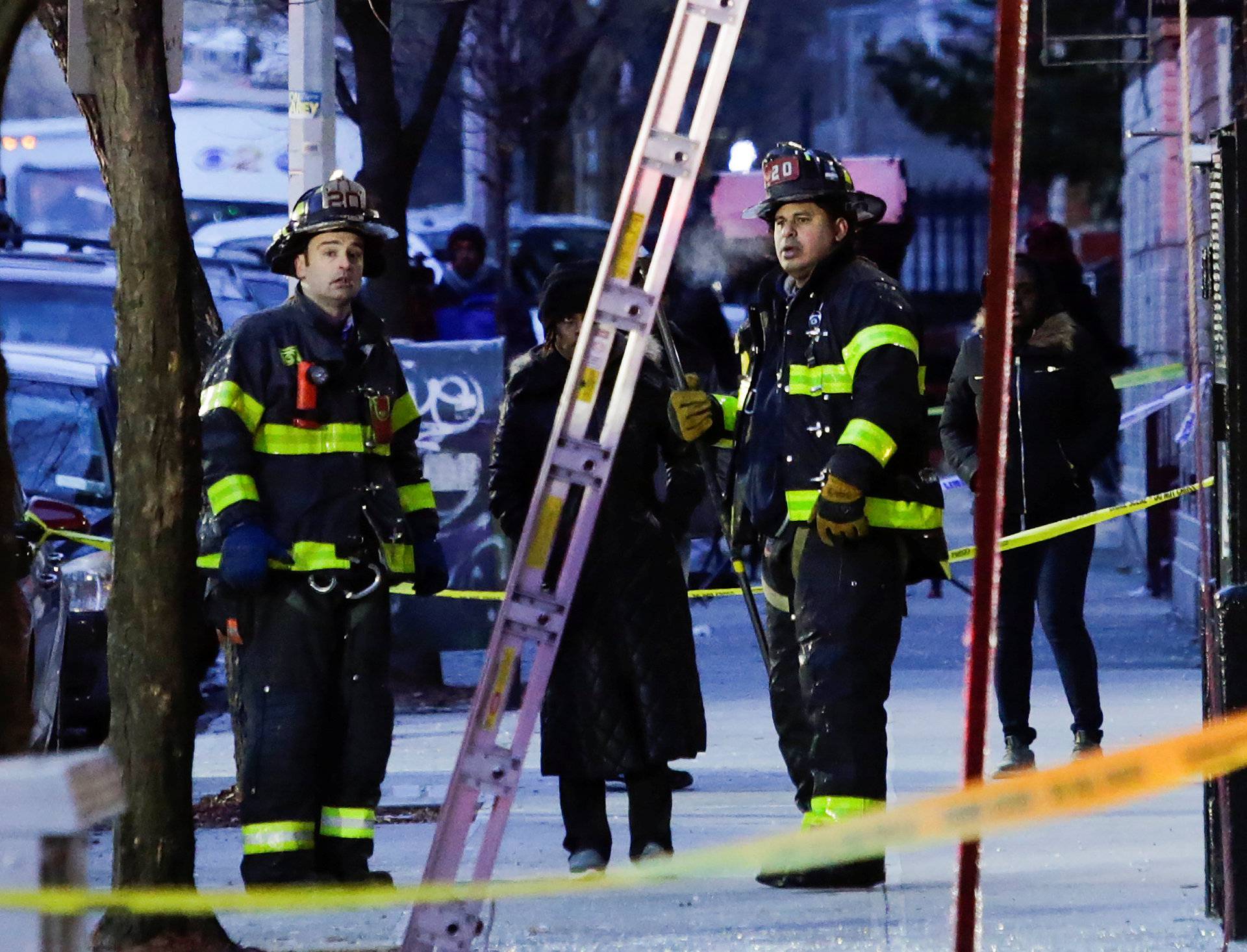 Fire Department of New York (FDNY) personnel work on the scene of an apartment fire in Bronx in New York