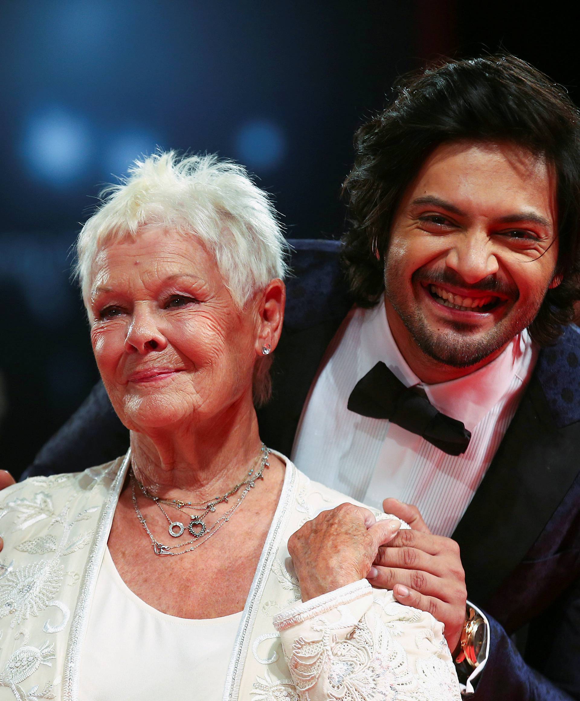Actors Ali Fazal and Judi Dench pose during a red carpet for the movie "Victoria and Abdul" at the 74th Venice Film Festival in Venice