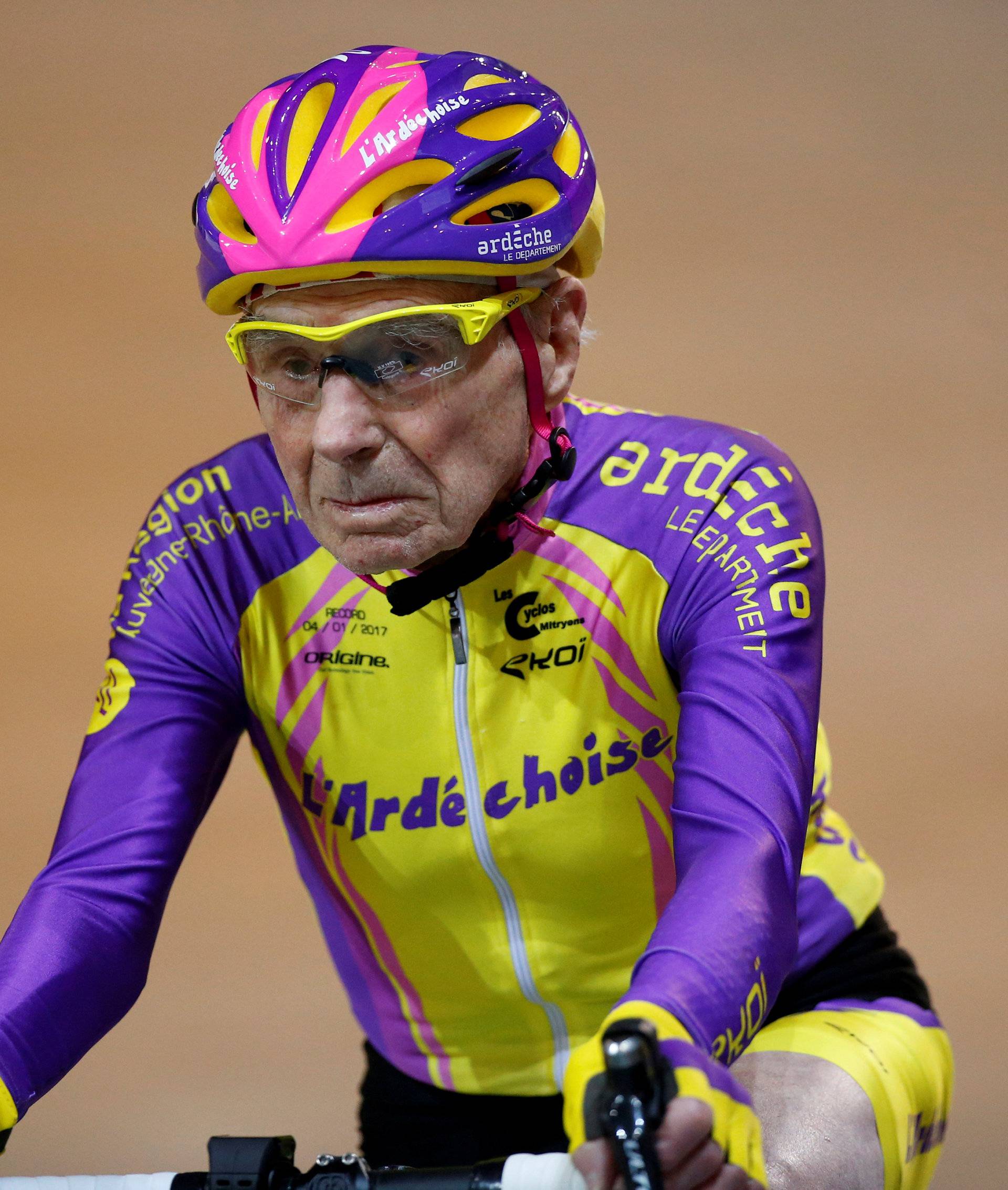 FILE PHOTO: French cyclist Robert Marchand, aged 105, rides on his way to cover 22.528 km (14.08 miles) in one hour to set a new record at the indoor Velodrome National in Montigny-les-Bretonneux