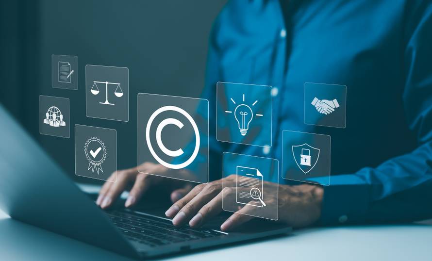 Copyright,Or,Patent,Concept.,Professional,Working,On,A,Laptop,With