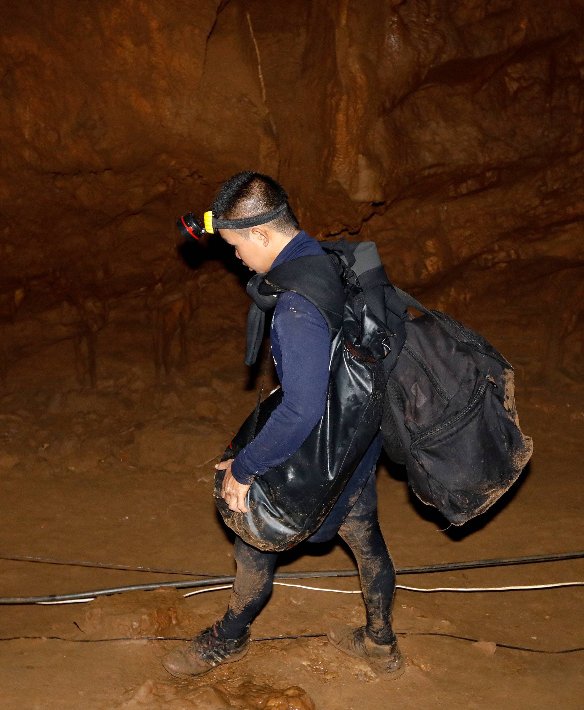 A rescue worker is seen inside of the Tham Luang caves where 13 members of an under-16 soccer team were trapped in the northern province of Chiang Rai