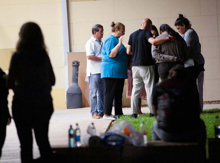 People react after a mass shooting at Robb Elementary School in Uvalde